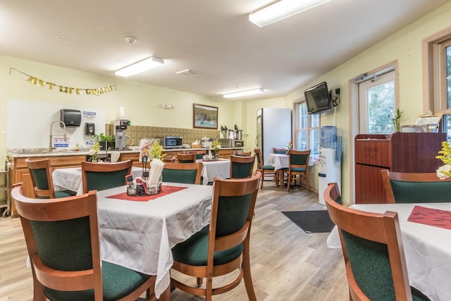 123 Center St Unit 301, Lake Geneva, WI 53147 - dining area with light wood finished floors