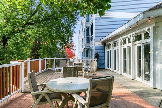 123 Center St Unit 301, Lake Geneva, WI 53147 - wooden deck featuring outdoor dining area