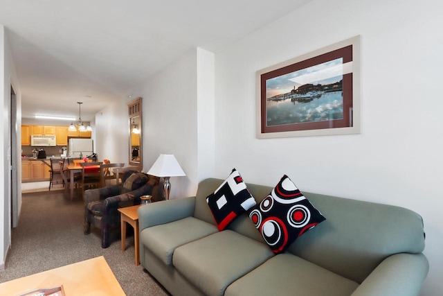 123 Center St Unit 301, Lake Geneva, WI 53147 - living area with carpet and a chandelier