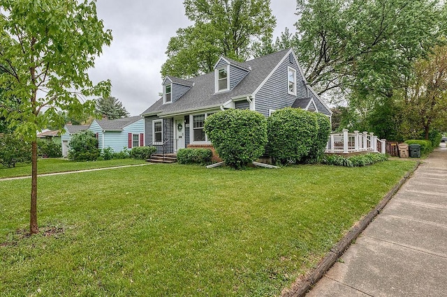 201 N Hillside Ter, Madison, WI 53705 - cape cod home featuring a front yard and a shingled roof