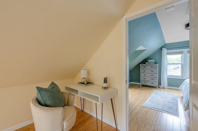 201 N Hillside Ter, Madison, WI 53705 - additional living space featuring vaulted ceiling, wood finished floors, and baseboards