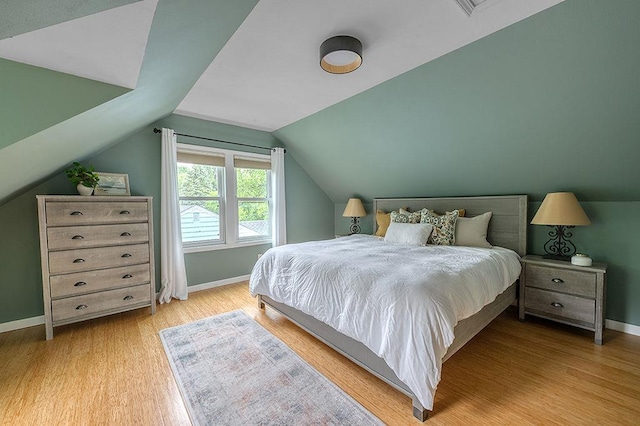 201 N Hillside Ter, Madison, WI 53705 - bedroom with baseboards, wood finished floors, and lofted ceiling