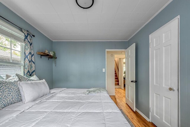 201 N Hillside Ter, Madison, WI 53705 - bedroom featuring crown molding and wood finished floors