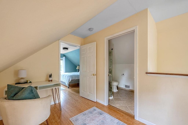 201 N Hillside Ter, Madison, WI 53705 - interior space featuring light wood-type flooring, vaulted ceiling, and baseboards