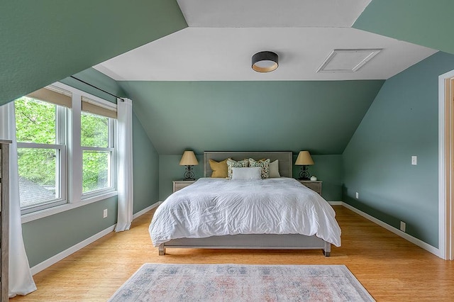 201 N Hillside Ter, Madison, WI 53705 - bedroom with vaulted ceiling, wood finished floors, and baseboards