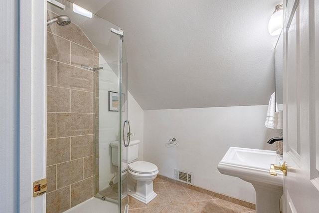 201 N Hillside Ter, Madison, WI 53705 - full bathroom with a stall shower, tile patterned flooring, toilet, lofted ceiling, and baseboards