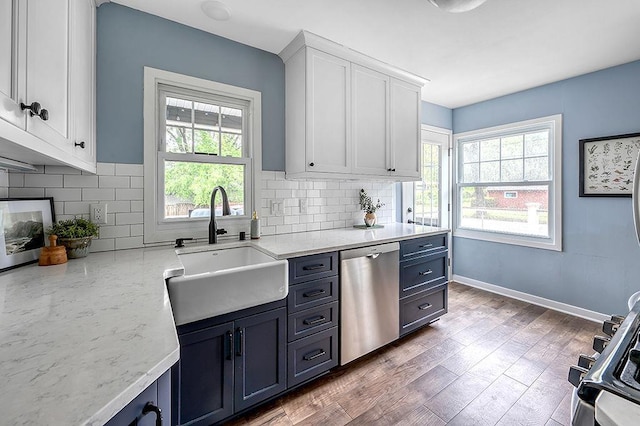 201 N Hillside Ter, Madison, WI 53705 - kitchen featuring a sink, dishwasher, healthy amount of natural light, and white cabinets