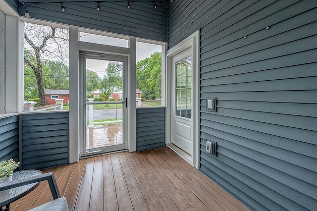 201 N Hillside Ter, Madison, WI 53705 - doorway with healthy amount of natural light, wood walls, hardwood / wood-style floors, and a towering ceiling