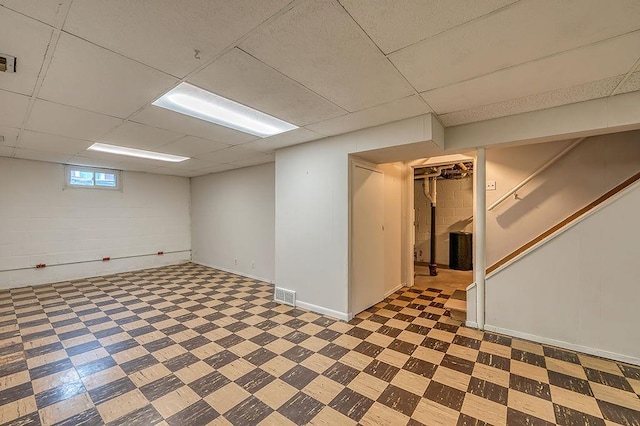 201 N Hillside Ter, Madison, WI 53705 - basement with tile patterned floors, a drop ceiling, and stairway