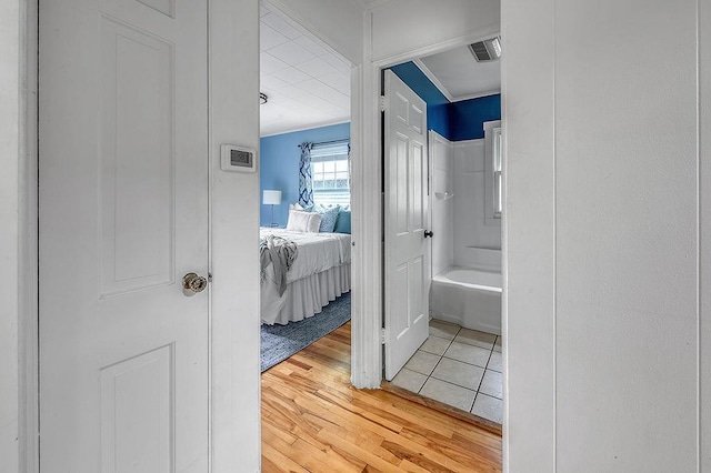 201 N Hillside Ter, Madison, WI 53705 - bathroom featuring wood finished floors and shower / washtub combination