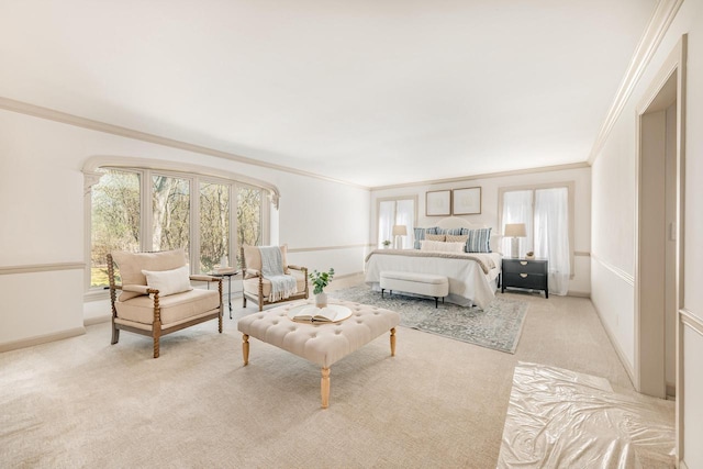 bedroom with multiple windows, ornamental molding, carpet floors, and baseboards