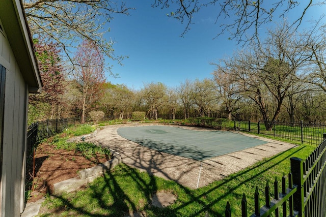 view of swimming pool with a fenced backyard and a patio