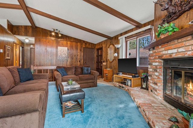 1074 E Queens Way, Nekoosa, WI 54457 - carpeted living area featuring wooden walls, a fireplace, and lofted ceiling with beams