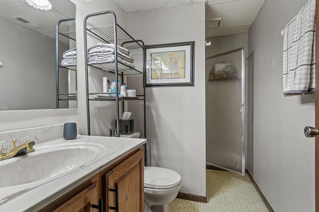 1074 E Queens Way, Nekoosa, WI 54457 - bathroom featuring toilet, visible vents, baseboards, and vanity