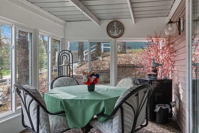 1074 E Queens Way, Nekoosa, WI 54457 - sunroom / solarium with beamed ceiling, outdoor dining space, and plenty of natural light