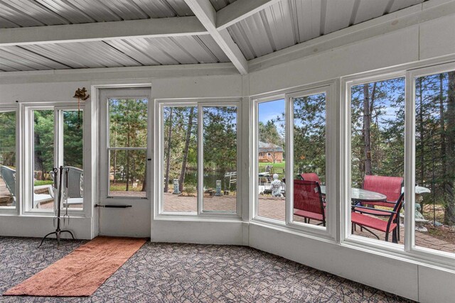 1074 E Queens Way, Nekoosa, WI 54457 - unfurnished sunroom featuring beamed ceiling and plenty of natural light