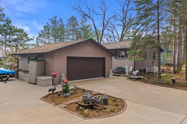 1074 E Queens Way, Nekoosa, WI 54457 - exterior space with driveway and a garage