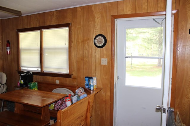 dining area featuring wooden walls
