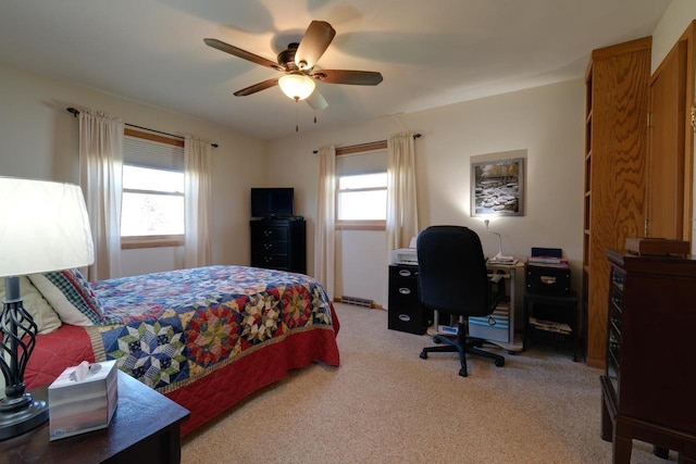 bedroom featuring light colored carpet and ceiling fan