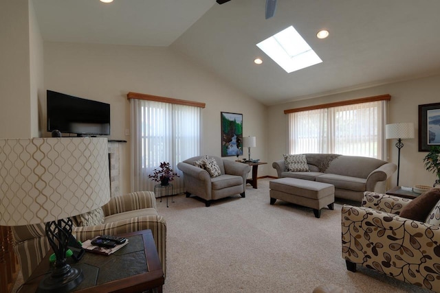 living area with lofted ceiling with skylight, recessed lighting, and carpet