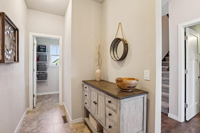 521 Dragon Willow Ln, Middleton, WI 53562 - hallway featuring baseboards and stairway