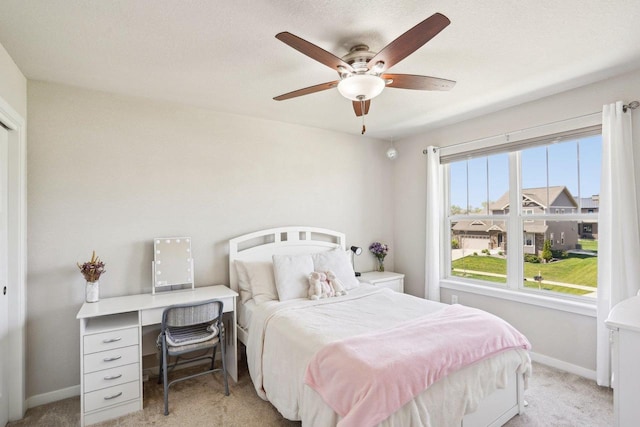 521 Dragon Willow Ln, Middleton, WI 53562 - bedroom with light colored carpet, baseboards, and a ceiling fan