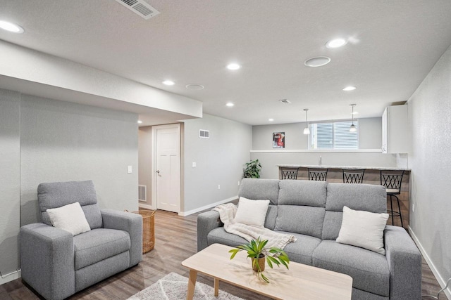 521 Dragon Willow Ln, Middleton, WI 53562 - living room with wood finished floors, recessed lighting, and baseboards