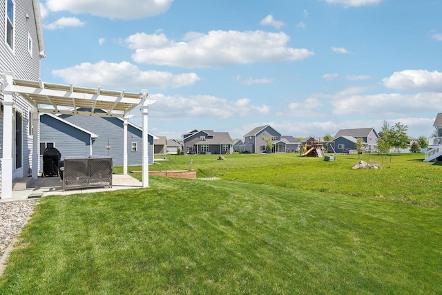 521 Dragon Willow Ln, Middleton, WI 53562 - view of grassy yard featuring a residential view, a patio area, a pergola, and a playground