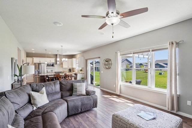 521 Dragon Willow Ln, Middleton, WI 53562 - living room featuring baseboards, ceiling fan, wood finished floors, and recessed lighting