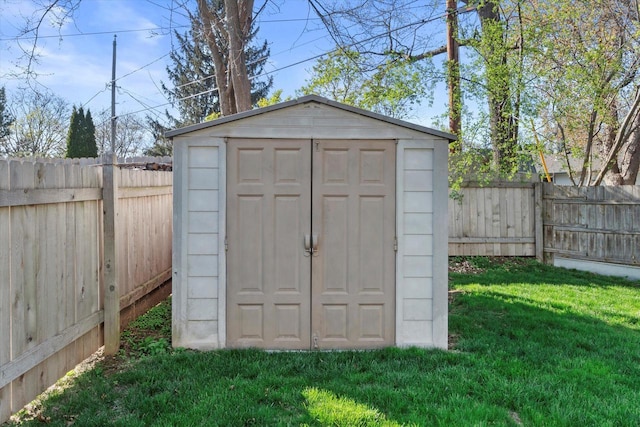 view of shed featuring a fenced backyard