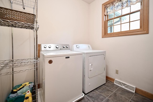 W157 Thomas Rd, Fountain City, WI 54629 - laundry area with washer and dryer, baseboards, and dark tile patterned floors