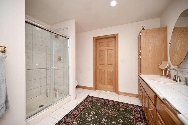 W157 Thomas Rd, Fountain City, WI 54629 - full bath featuring tiled shower, toilet, vanity, tile patterned flooring, and recessed lighting