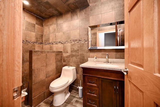 W157 Thomas Rd, Fountain City, WI 54629 - bathroom with toilet, vanity, and tile walls