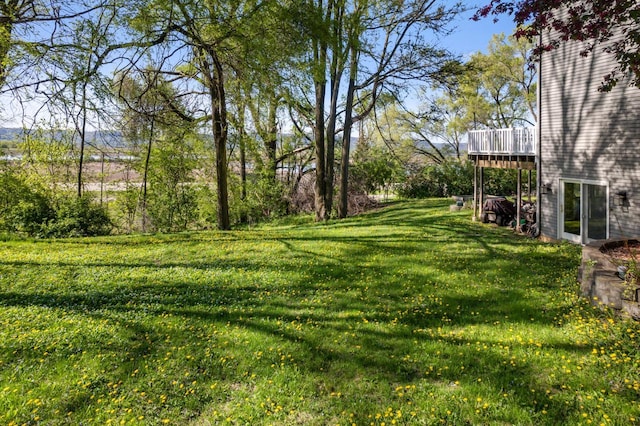 W157 Thomas Rd, Fountain City, WI 54629 - view of green lawn featuring a wooden deck