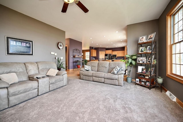 W157 Thomas Rd, Fountain City, WI 54629 - carpeted living area featuring ceiling fan, plenty of natural light, recessed lighting, and baseboards