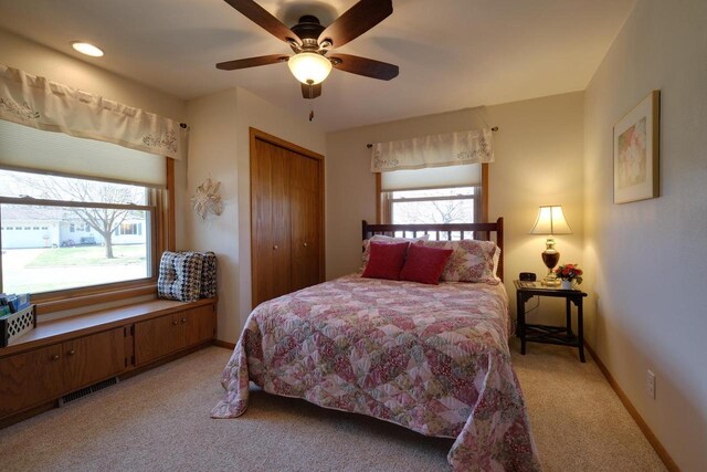 425 S Ventura Ln, Whitewater, WI 53190 - bedroom with a closet, baseboards, ceiling fan, visible vents, and light colored carpet