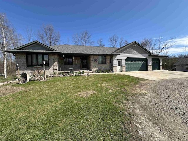 ranch-style house featuring a front yard, brick siding, driveway, and a garage
