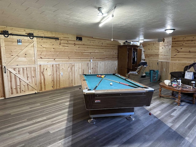 game room with billiards, wood walls, and wood finished floors