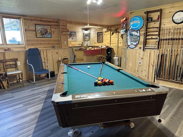 playroom featuring wood walls, wood finished floors, and pool table
