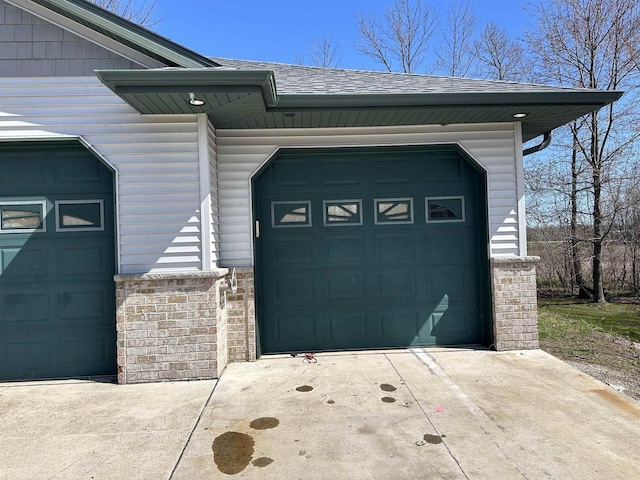 garage featuring driveway