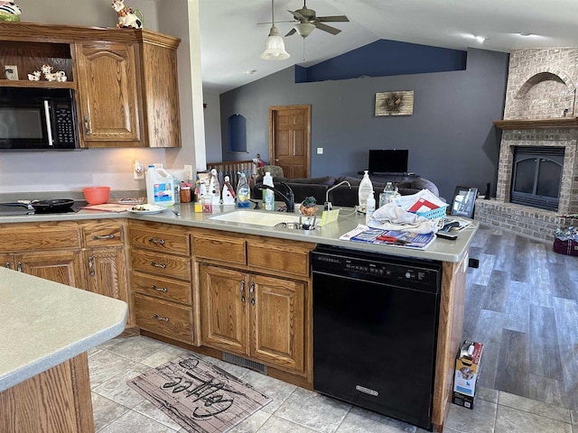 kitchen featuring ceiling fan, a peninsula, open floor plan, black appliances, and light countertops