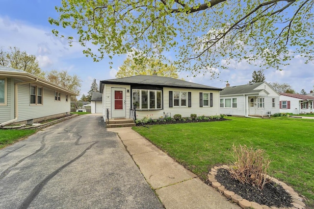 bungalow-style home featuring a front yard