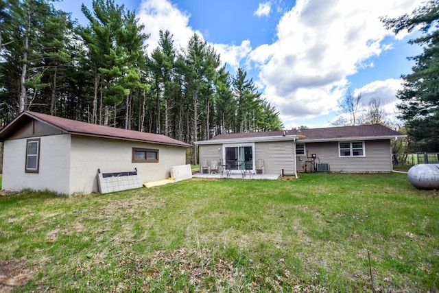 W4144 Fawn Ave, Montello, WI 53949 - rear view of house with a yard, central AC, and a patio