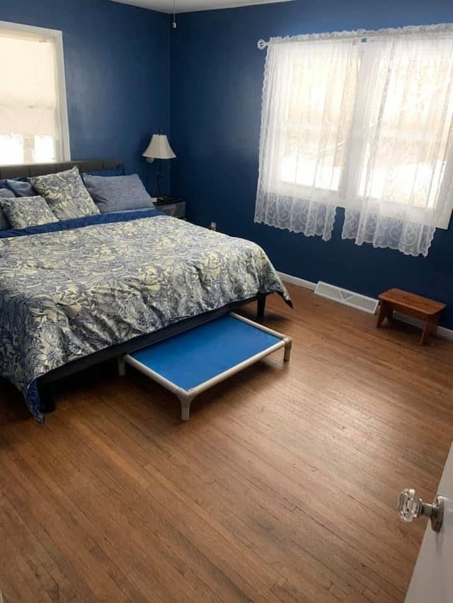 W4144 Fawn Ave, Montello, WI 53949 - bedroom featuring wood finished floors and baseboards