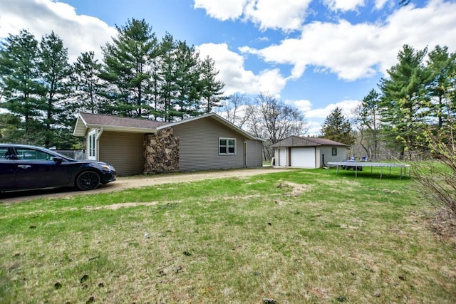 W4144 Fawn Ave, Montello, WI 53949 - view of property exterior with a garage, an outdoor structure, and a lawn