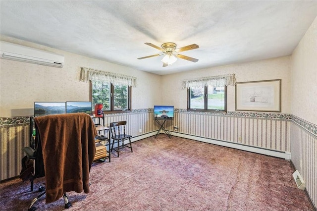 sitting room with ceiling fan, a wall mounted AC, carpet floors, and baseboard heating
