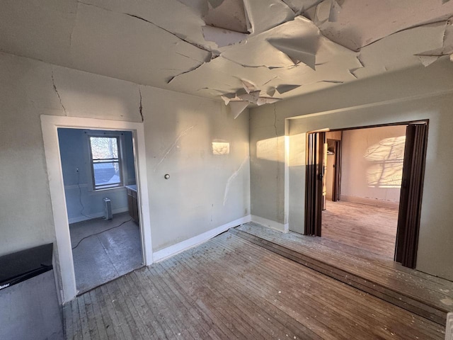 empty room featuring wood finished floors