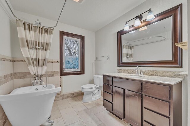 8408 N Lake Dr, Fox Point, WI 53217 - full bath featuring toilet, a shower with curtain, a soaking tub, tile patterned floors, and vanity