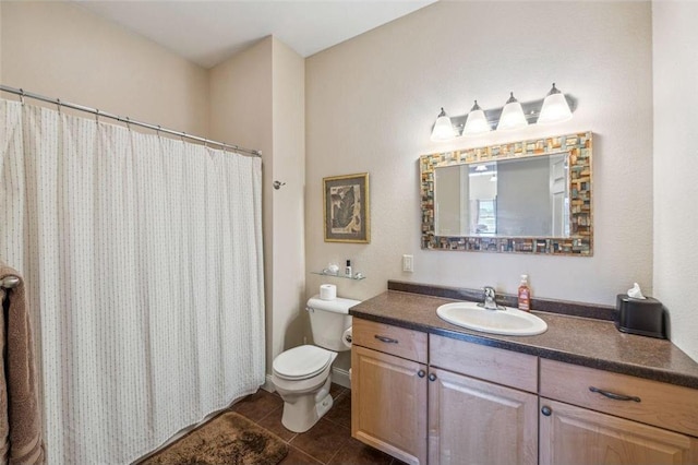 bathroom featuring toilet, tile patterned floors, vanity, and curtained shower