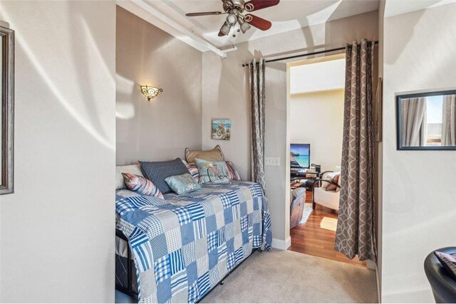 carpeted bedroom with a ceiling fan